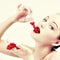 Woman eating red berries