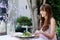 Woman eating salad, alfresco dining