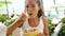 Woman eating salad at restaurant