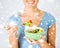 Woman eating salad with vegetables