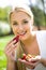 Woman eating strawberries