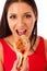 Woman eating tasty piece of pizza. Unhealthy fast food meal.