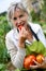 Woman eating tomatoes from garden