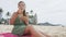 Woman Eating Traditional Hawaii Dish On Beach