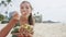 Woman Eating Traditional Hawaiian Food At Beach