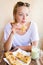 Woman eating traditional moroccan breakfast in coffee shop.