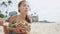 Woman Eating Traditional Poke Salad At Beach