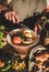 Woman eating Turkish meat soup Haslama with vegetables with fork