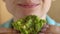 Woman eating vegan avocado sandwich closeup