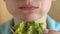 Woman eating vegan avocado sandwich closeup