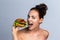 Woman eating vegetable burger