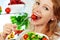 woman eats healthy food vegetable vegetarian salad about refrigerator