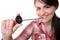 Woman eats a liquorice candy wheel