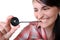 Woman eats a liquorice candy wheel