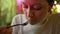 Woman eats salad and enjoys atmosphere sitting in cafe