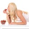 Woman eats strawberry