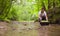 Woman ecologist opening a tool box and taking samples of water