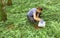 Woman ecologist taking samples of a soil