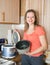 Woman with electric slow cooker