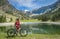 Woman on electrick Mountain bike in the Allgaeu Alps near Below Nebelhorn
