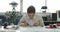 Woman electronics engineer is soldering an electric board in her workshop.