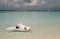 Woman in elegant beach clothes relaxing on Maldives island