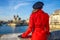 Woman on embankment near Notre Dame de Paris in Paris, France