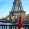 Woman on embankment in Paris, France looking into distance