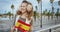 Woman on embankment with Spanish flag looking into distance