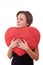 Woman embrace a heart-shape pillow