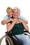 Woman embracing disabled senior