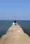 Woman at end of long pier