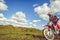 Woman on enduro motocross in motion, desire for victory, dynamics of speed