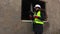 Woman Engineer inspecting the construction of unfinished building