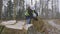 Woman engineer measuring diameter of fallen tree