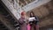 Woman engineer talking to a foreman on the construction site, solving organizational issues.