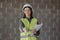 woman engineer in a white helmet and safety vest, the engineer on the construction site