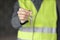 woman engineer in a white helmet and safety vest, the engineer on the construction site