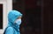 A woman in an English town centre wearing a face mask in public on the weekend that wearing face coverings became law in Englan