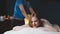 Woman enjoing back massage at spa. Leisure, Health, Luxury Lifestyle Concept