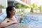 Woman enjoy drink in jacuzzi spa