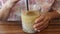 Woman enjoy drinking craft iced milk coffee