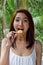 Woman enjoy eating fried potato chip