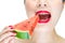 Woman enjoy eating watermelon with red lips, bite, Nail Polish