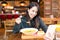 Woman enjoy her soup and taking selfie