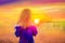 Woman enjoy with sunshine in wheat field