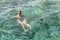 woman enjoy swimming in the sea. Young woman swims in the sea. The sports girl swims in the sea