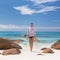 Woman enjoying Anse Lazio picture perfect beach on Praslin Island, Seychelles.