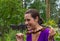 Woman enjoying barbecue outdoors