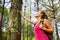 Woman enjoying the beautiful pines travel green forest in Europe